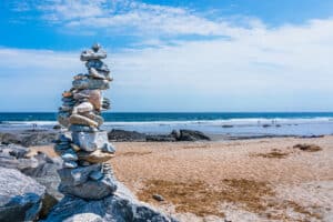Close-up of a cairn stones against a beach in Hampton Beach